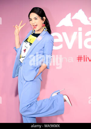 **TAIWAN OUT**Taiwanese singer Ella, or known as Chen Chia-hwa, attends a press conference of Evian, a French brand of mineral water, promoted Evian v Stock Photo