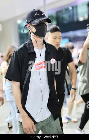 Chinese actor and singer Wang Yibo of South Korean-Chinese boy band UNIQ arrives at an airport in Shanghai, China, 29 July 2019. Stock Photo