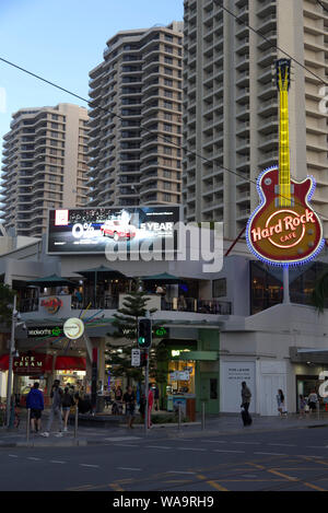 Pedestrians walking past the Hard Rock Cafe on Surfers Paradise 