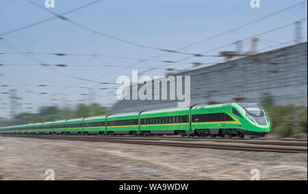 --FILE--A CR200J Fuxing bullet train of CRRC (China Railway Rolling Stock Corp Ltd) runs on a rail line in Beijing, China, 24 May 2019. China's major Stock Photo