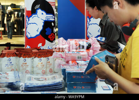 Customers visit an exhibition held to mark the 60th anniversary of iconic Chinese candy brand White Rabbit at a shopping mall in Beijing, China, 3 Jul Stock Photo