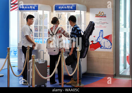 Customers visit an exhibition held to mark the 60th anniversary of iconic Chinese candy brand White Rabbit at a shopping mall in Beijing, China, 3 Jul Stock Photo