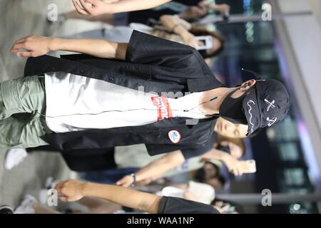 Chinese actor and singer Wang Yibo of South Korean-Chinese boy band UNIQ arrives at an airport in Shanghai, China, 29 July 2019. Stock Photo