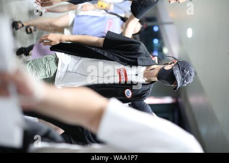 Chinese actor and singer Wang Yibo of South Korean-Chinese boy band UNIQ arrives at an airport in Shanghai, China, 29 July 2019. Stock Photo