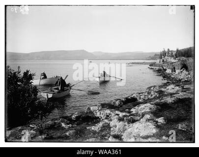 Choice set of thirteen slides, illustrating the Sea of Galilee and its fishermen still toiling with their nets. Fishing boats at Bethsaida Stock Photo