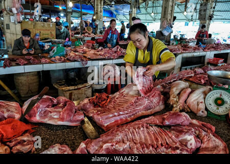 Sapa, Vietnam - August 24: Hmong woman selling meat at the market on August 24, 2018 in Sapa, Vietnam. Stock Photo