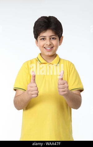 11 years boy showing thumbs up gesture Stock Photo - Alamy