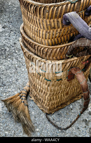 Handmade woven bamboo baskets and dishes for sale in street market in Vietnam. Stock Photo