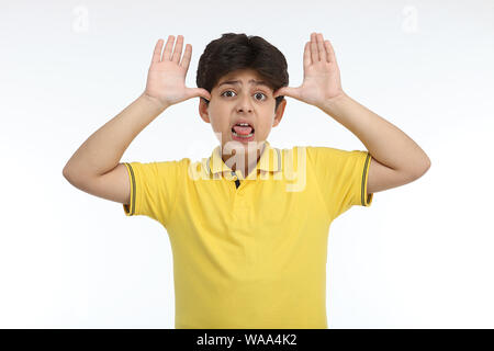 Boy teasing towards camera Stock Photo