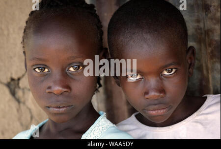 Portrait of a boy and girl in a slum in Nairobi, Kenya Stock Photo