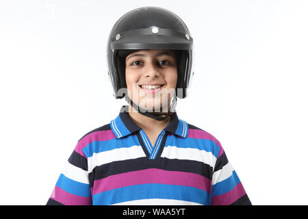 Portrait of a boy wearing helmet and smiling Stock Photo