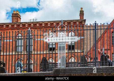 Black Sabbath Bridge sign over the Birmingham City Centre path at Broad Street, on the Birmingham Old Line Canal Birmingham, UK Stock Photo