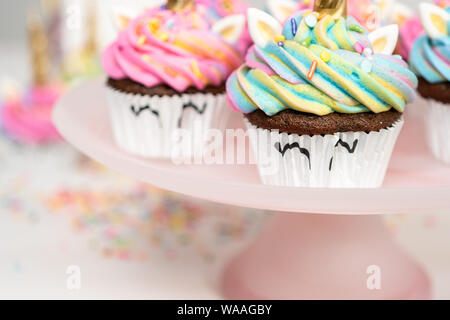 Step by step. Scooping batter with a cupcake scoop to make unicorn  chocolate cupcakes with buttercream frosting Stock Photo - Alamy