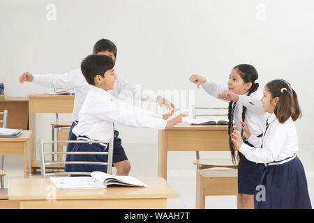 Students playing in a classroom Stock Photo