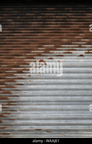 A Partially Rusted Roller Shutter Stock Photo
