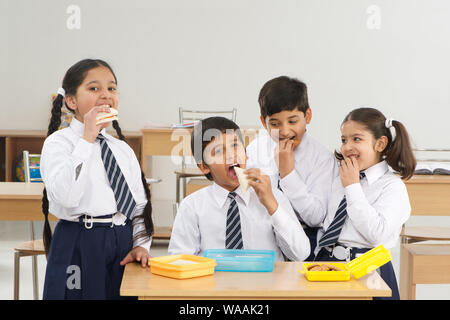 Students eating lunch in classroom