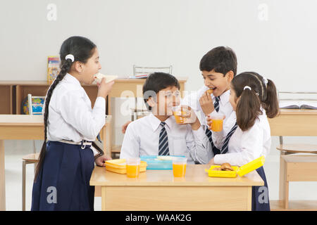 Students eating lunch in classroom
