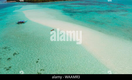 Sand bar in transparent turquoise water top view. Tropical beach with tourists. Mansalangan sandbar, Balabac, Palawan, Philippines. Summer and travel vacation concept Stock Photo