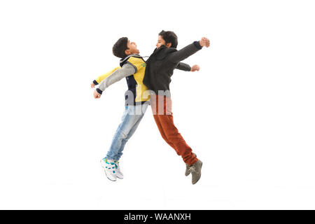 Two boys hitting chests together Stock Photo