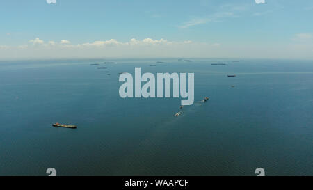 Arial view of ships at anchor in Manila Bay. Cargo ships in the harbor.