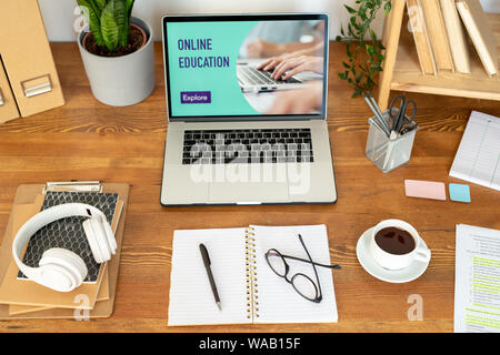 Laptop and other office supplies and objects on the desk Stock Photo