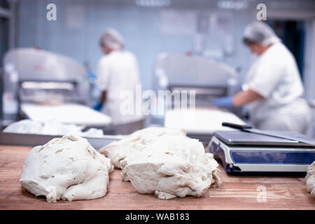 Pieces of dough, dumpling production. Chefs make dumplings Stock Photo
