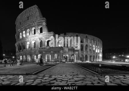 A black and white night photo of Rome's incredible Colosseum Stock Photo