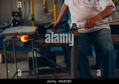 Glass blower artist  crafter forming piece of glass. Murano and Burano, Italy. Stock Photo