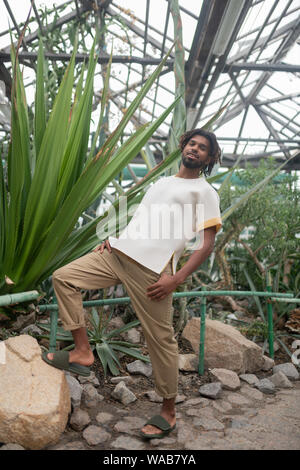 Bearded man posing while promoting summer collection Stock Photo
