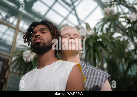 Two men of different skin color participating in social campaign Stock Photo
