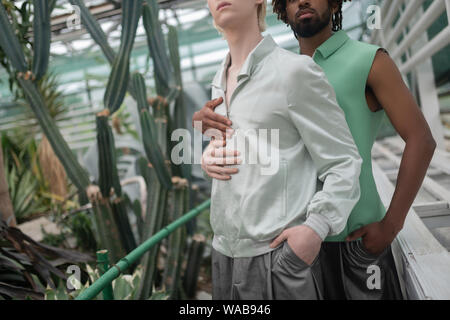 Two models hugging while promoting summer clothing Stock Photo