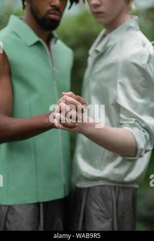 Two men participating in social campaign posing with hands Stock Photo