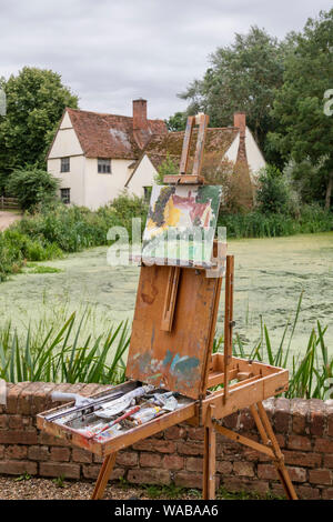 Artists painting Willy Lott's house at the National Trust's Flatford Mill made famous by the artist John Constable 1776 -1837,  Suffolk, England, UK Stock Photo