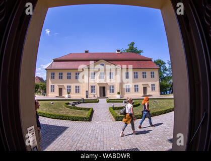 Mirow, Germany. 25th May, 2019. Tourists visit Mirow Castle. The state of Mecklenburg-Vorpommern has invested around eight million euros in the renovation of this historic building since 2005. After years of closure, the Rococo Castle was reopened in the summer of 2014. Credit: Jens Büttner/dpa-Zentralbild/ZB/dpa/Alamy Live News Stock Photo