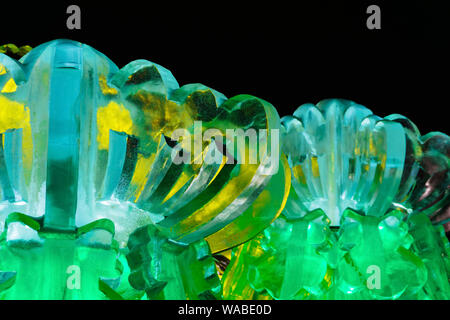 Perm, Russia - January 03, 2019: illuminated ice sculptures of lotus flowers in the New Year's town square Stock Photo