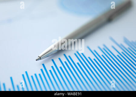 Silver pen lies on paper documents with color Stock Photo