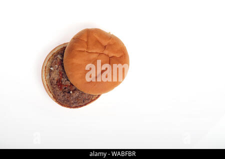 McDonald’s fast food hamburger with ketchup and onions isolated on white background Stock Photo