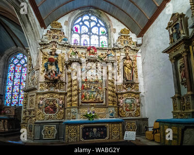 Ornate altar piece  of Notre-Dame de Lampaul-Guimiliau church, Finistere department, Bretagne, France Stock Photo