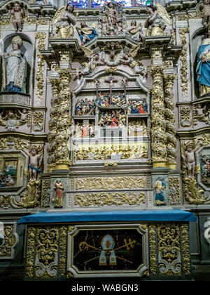 Ornate altar piece  of Notre-Dame de Lampaul-Guimiliau church, Finistere department, Bretagne, France Stock Photo