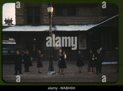 Commuters, who have just come off the train, waiting for the bus to go home, Lowell, Mass. Stock Photo