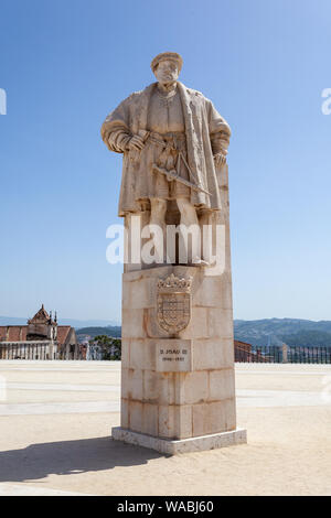 The statue of King Joao III in the courtyard square of the Old University (Patio das Escoles) of Coimbra, Beira Litoral, Portugal Stock Photo
