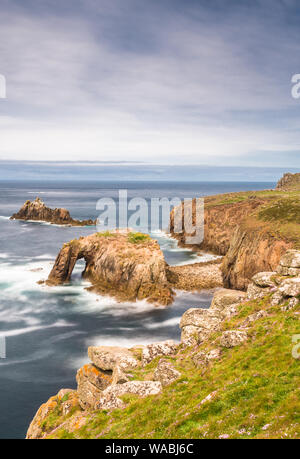 Enys Dodnan and the Armed Knight rock formations at Lands End, Cornwall, England, United Kingdom, Europe. Stock Photo