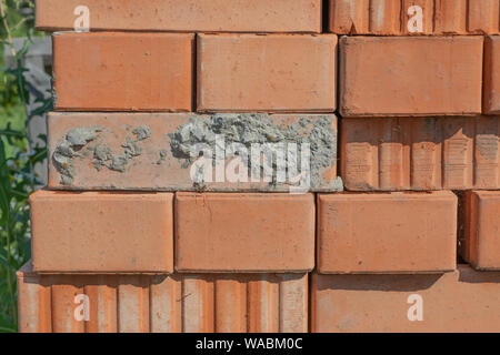 Bricks stacked in piles. Broun bricks background Stock Photo