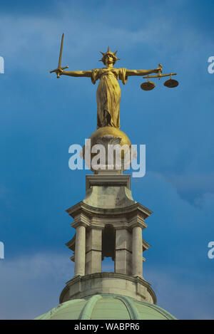 The bronze statue of Lady Justice on the top of The Old Bailey Court, London, England. UK Stock Photo