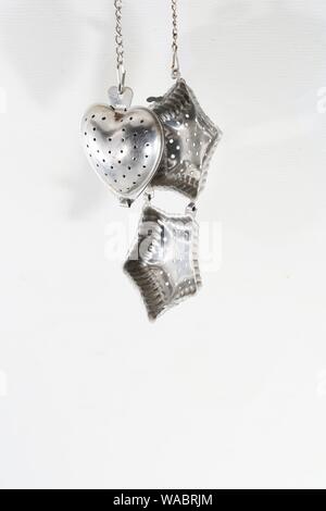 Tea strainer is indispensable in the kitchen for the preparation of fresh tea Stock Photo