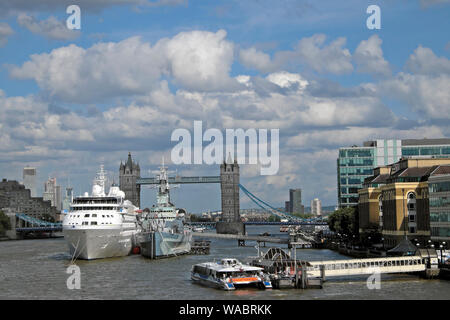 View of Tower Bridge ships and tourist boats on the River Thames on a summer day in Central London England UK  KATHY DEWITT Stock Photo