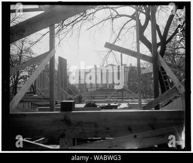 Construction of Inaugural stands in Court of Honor started. Washington, D.C., Dec. 23. A view of the White House through the construction work of the Court of Honor inaugural stands. Directly opposite these stands will be the President's reviewing stand Stock Photo