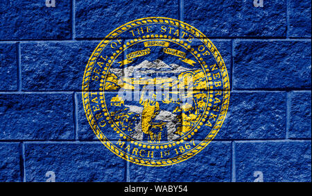 Flag State of Nebraska close up painted on a cracked wall Stock Photo