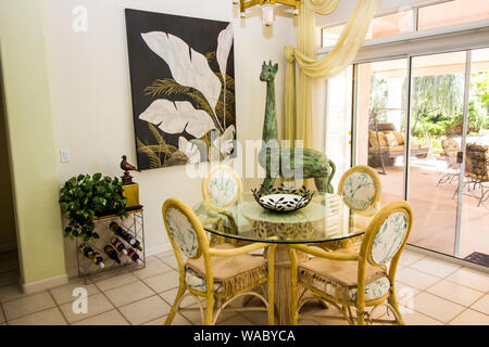 Round Glass Table And Chairs In Modern Dining Area Stock Photo