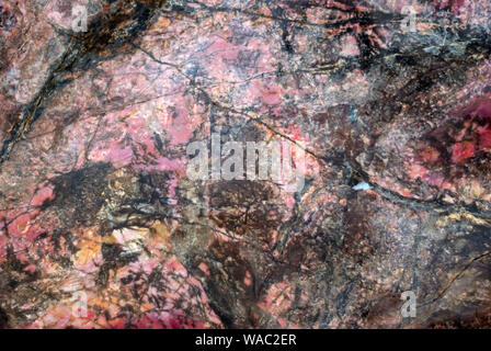 background, texture - natural pink rhodonite rock surface Stock Photo